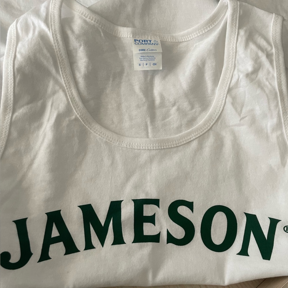 Jameson white cotton tank top with green lettering